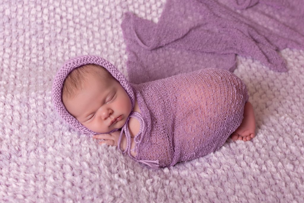 Wrapped newborn baby girl session with purple wrap in Clarksville, TN