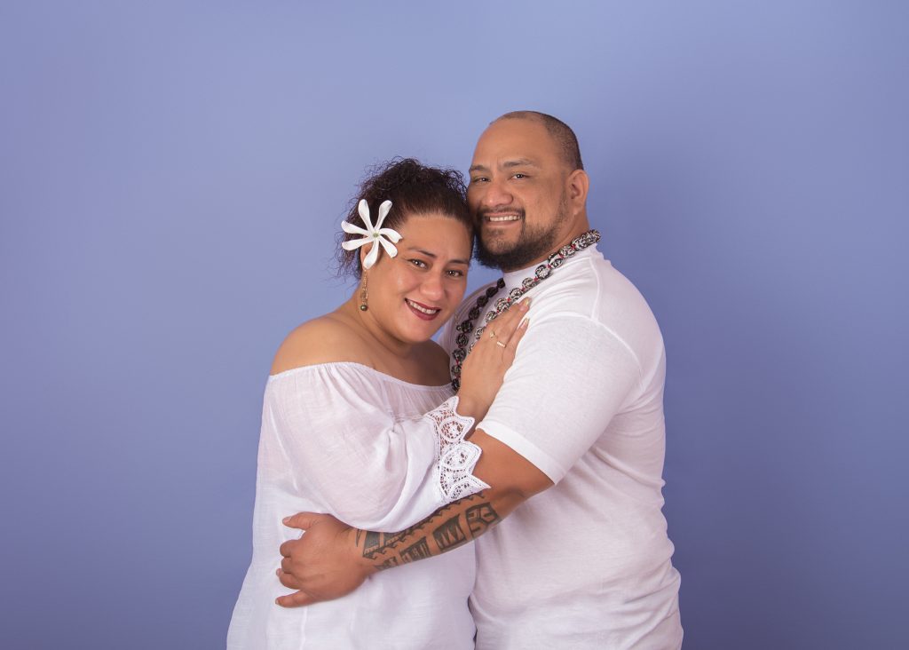 Clarksville Family Photographer in the studio with a blue backdrop