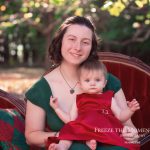 Mother daughter holiday christmas photo session with green and red dress red victorian vintage style couch