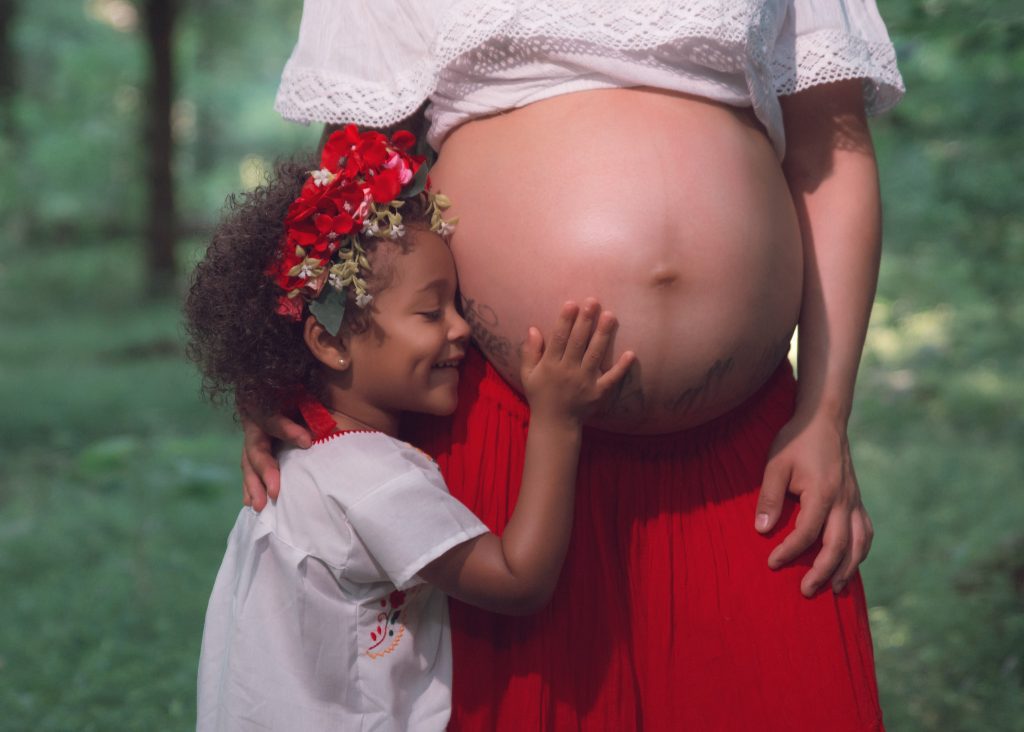 Mexican-themed Cultural Tribal Maternity dress shoot in Clarksville Tennessee TN Mother daughter touching belly