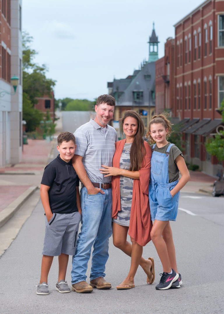 Clarksville Family Photographer capturing a photo in downtown Clarksville Tennessee TN
