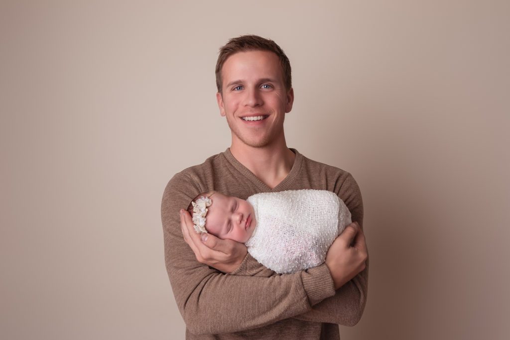 father and daughter during studio newborn session in Clarksville tn