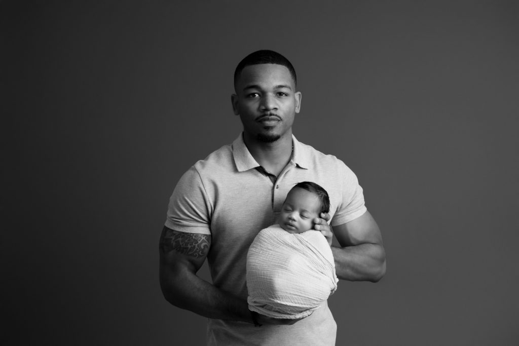 newborn photos in Clarksville tennessee with father and son black and white