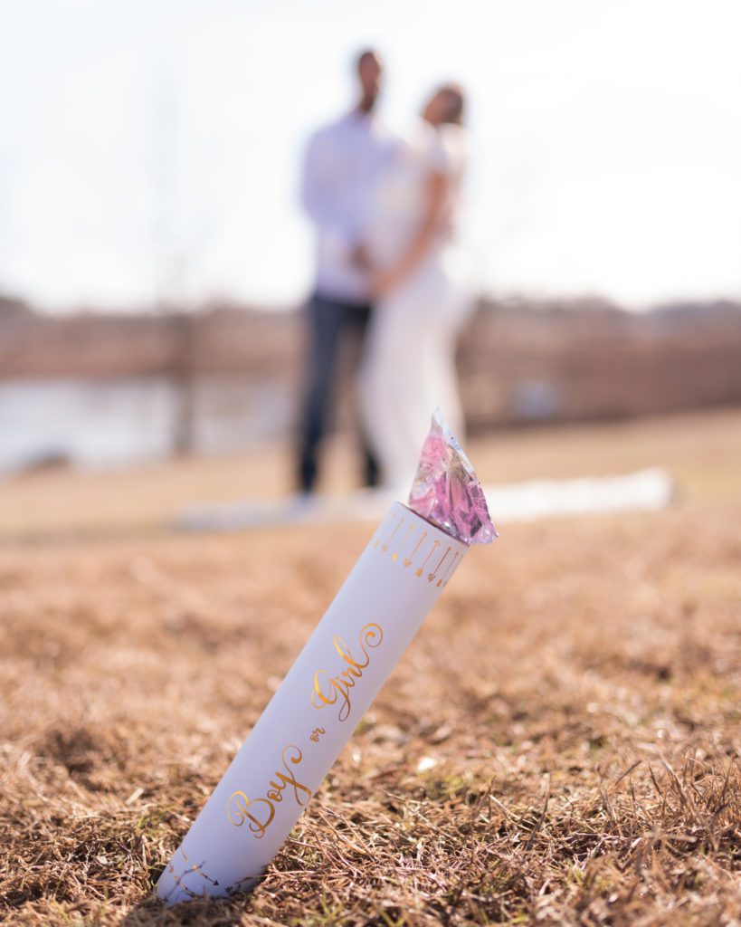 Maternity gender reveal with smoke bomb