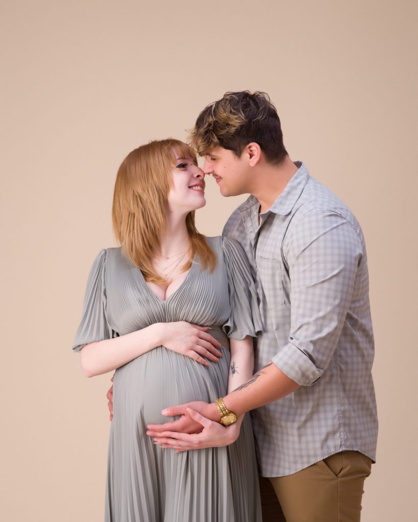 Maternity session with husband touching noses