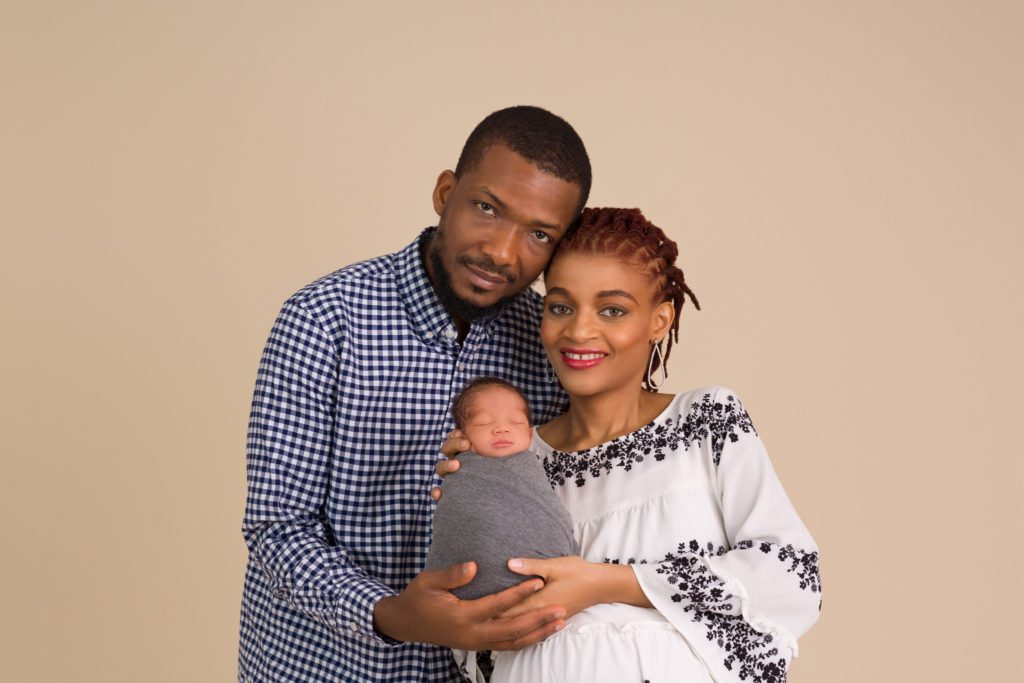 Mom dad and newborn baby family photo