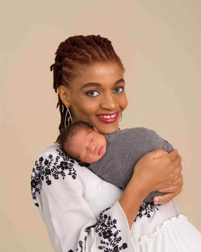 Mom and newborn baby in newborn session